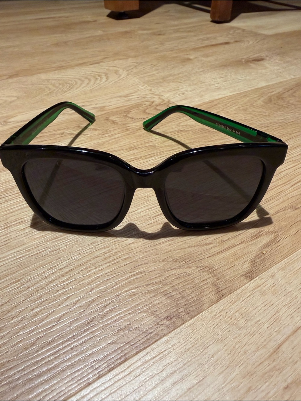 Gucci Women’s Black Sunglasses with Green Temples